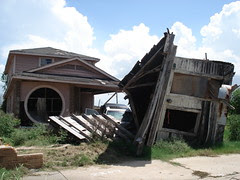 House on Car washed up to another house