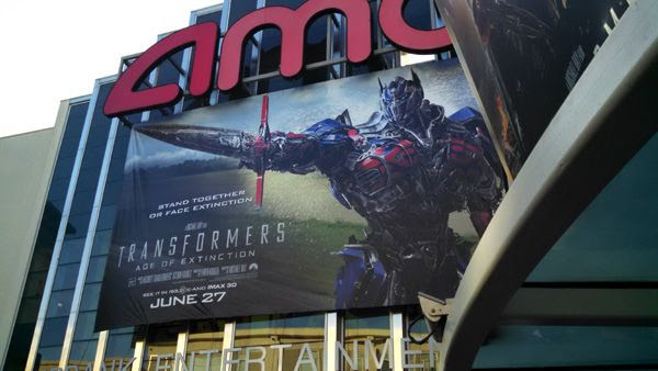 An advertisement for TRANSFORMERS: AGE OF EXTINCTION outside the AMC 16 theater in Burbank, California.