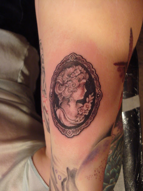 black and grey cameo tattoo
