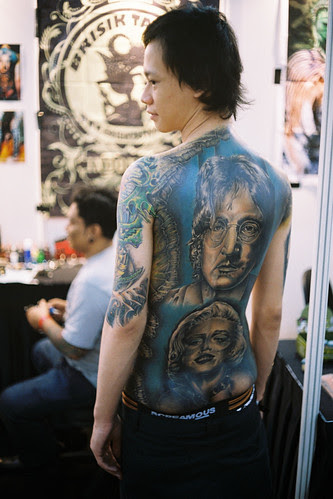 Woman Tattoos at Male Hinder 