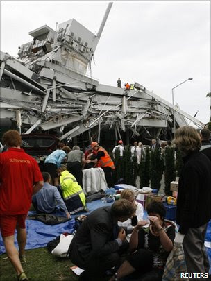 Injured people being treated outside collapsed Pyne Gould Guinness building, Christchurch 22 Feb 2011