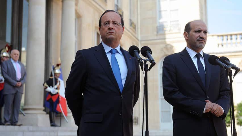 French President François Hollande, left, speaks to the media last week following a meeting with Ahmad Al-Assi Al-Jarba, leader of the opposition Syrian National Coalition. Hollande has condemned Syria's alleged use of chemical weapons and has said he is 'ready to punish' those responsible. 