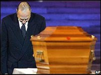 French President Jacques Chirac bows at the coffin of author Alexandre Dumas