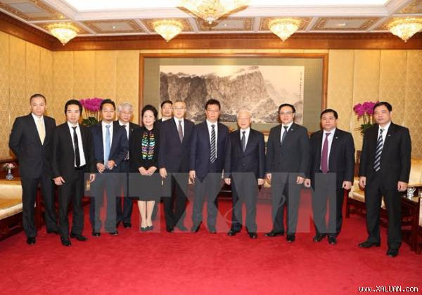 Tổng Bí thư Nguyễn Phú Trọng tiếp đoàn Công ty Hoa Hạ của Trung Quốc. (Ảnh: Trí Dũng/TTXVN)