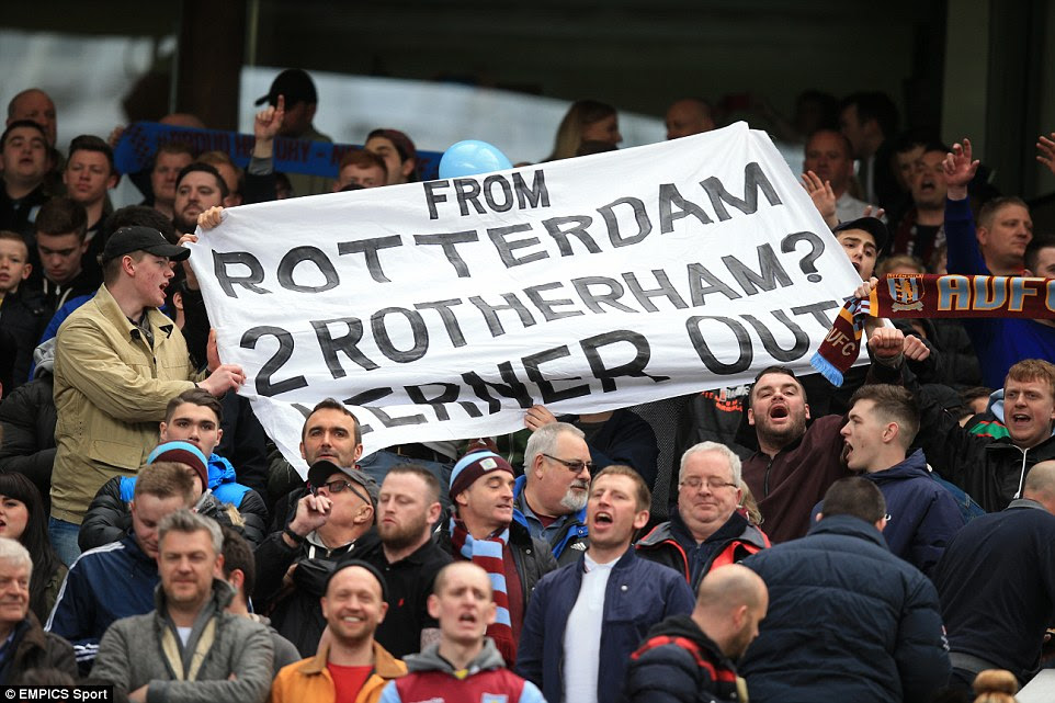 Aston Villa supporters let their feeling towards the club's owner Randy Lerner be known as they unfurl a banner calling for him to leave
