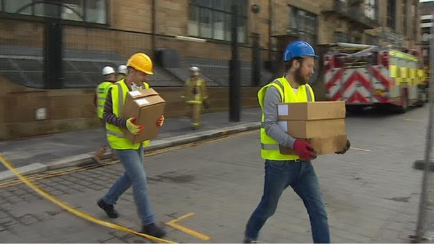 Men carrying boxes