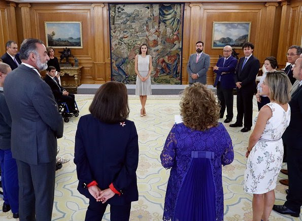 Queen Letizia wore Hugo Boss pleated Skirt occasion dress, Magrit pumps and Tous Jewelers Gold diamond earrings