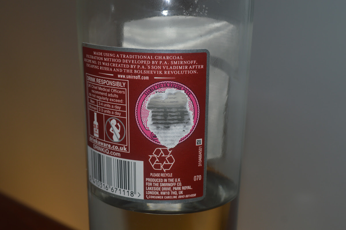 Why do the bottles of Smirnoff I buy have torn labels ...