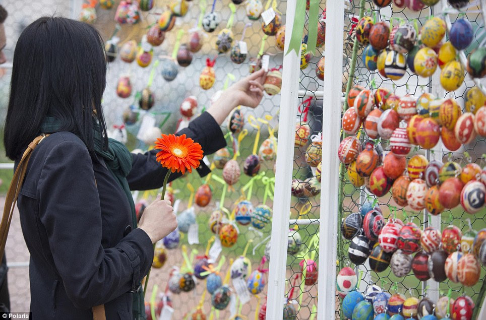 Life goes on: Families visit Easter egg displays in the Orthodox church garden grounds of Saint Sophia Cathedral in central Kiev