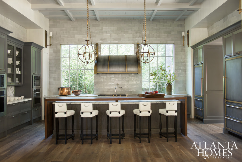 Grounded with Grace | AH&L Working with Matthew Quinn of Design Galleria, Ladisic chose Calacatta  Ondulato marble for the countertops and built a custom hood with brass  accents.