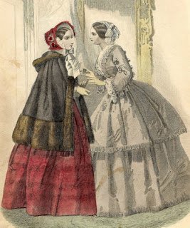 layered cape with matching trim at hood
