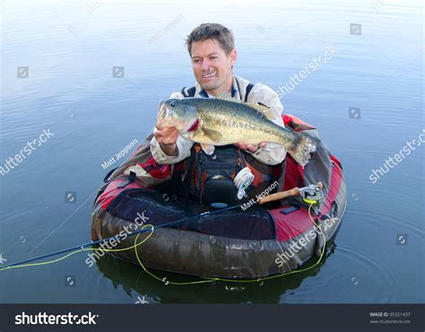 fly fisherman pontoon float tube belly stock photo