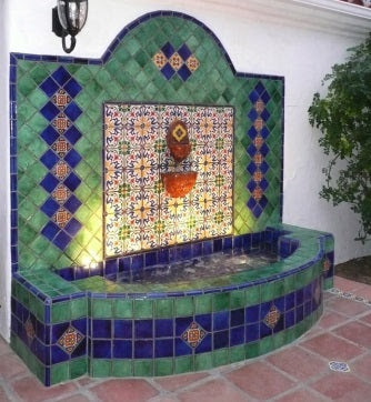 Spanish Santa Barbara Style tiled fountain with handmade patterned and solid-colored field tiles. Image via Pinterest