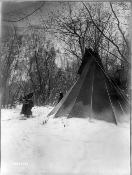 Description of  Title: When winter comes.  <br />Date Created/Published: c1908 July 6.  <br />Summary: Dakota woman, carrying firewood in snow, approaches tipi.  <br />Photograph by Edward S. Curtis, Curtis (Edward S.) Collection, Library of Congress Prints and Photographs Division Washington, D.C.