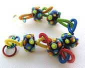 Lolly - Rainbow lampwork bumpies with bright multi-colored coiled wire bracelet - Jenniflair original