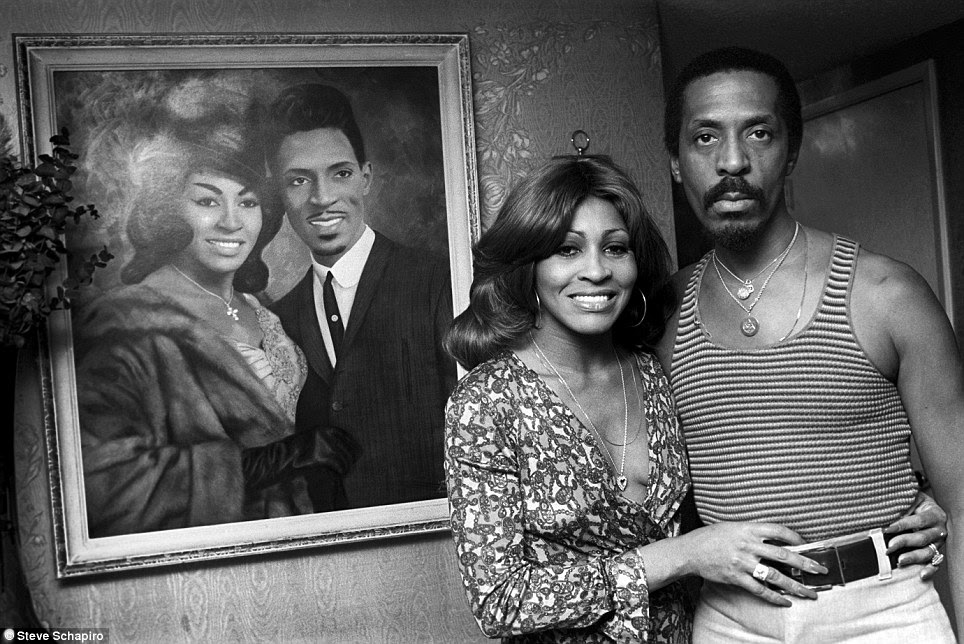 Picture in a picture: Ike and Tina Turner pose before a painting of themselves at their home