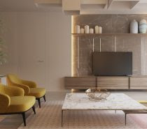 Our first space, for a couple with children, sits at a mere 180sqm. Located in Dnepropetrovsk, Ukraine, it was briefed to create a total of nine living spaces with an airy, light feel. Situating three living spaces within the one room, each area is spatially designated through colour and feel. The living room makes a stand with a wooden feel, where low wooden cabinetry, floors and wooden wall panels add a simplistic backdrop. Mustard chairs sing next to a light-grey L-sofa, while yellow patterns in the rug rush to greet it. LED strip and box lighting keep it modern, while a bamboo plant in the corner introduces nature. A marble TV cabinet and living room table add a touch of class unbreakable by the kids.