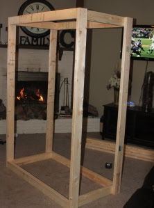 Next - attach the sceond rectangle wood square to the top of the 4 6'support legs