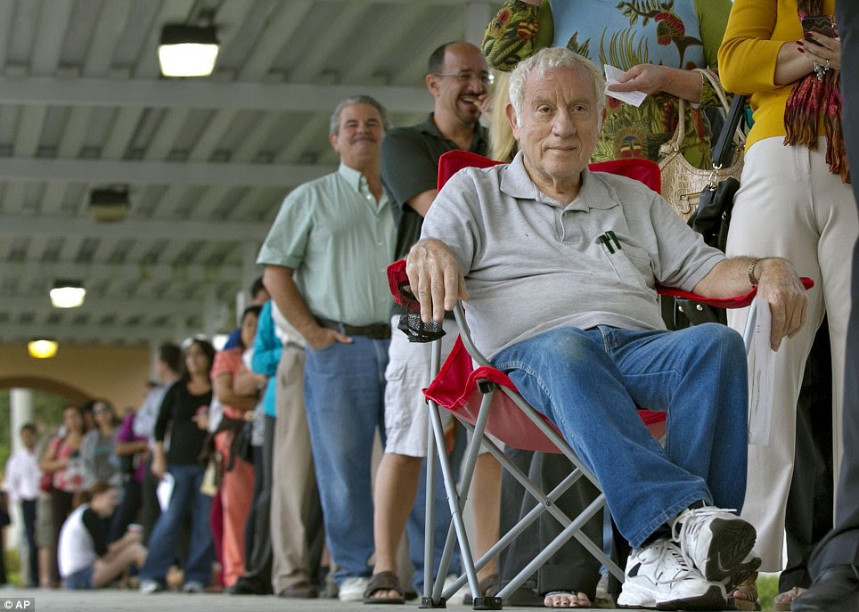Patience: The huge turnout surprised polling stations and led to delays in voting