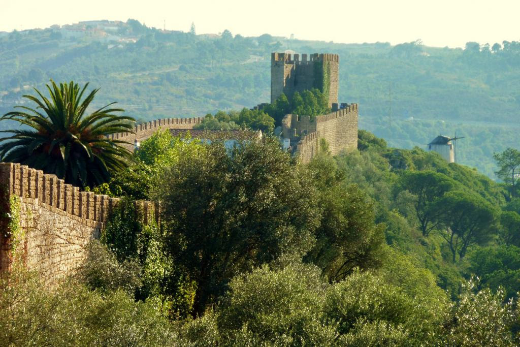 Portugal.  Obidos Castle.  The building was founded in the XII century;  used as a hotel since 1950.  Price per room per night - from € 150.  (Jason Pearce)