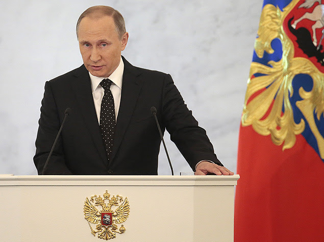 Russian President Vladimir Putin gives his annual state of the nation address in the Kremlin in Moscow, Russia, Thursday, Dec. 3, 2015. Putin says Russian military in Syria has been fighting for Russia's security. (AP Photo/Ivan Sekretarev) ORG XMIT: XDL102