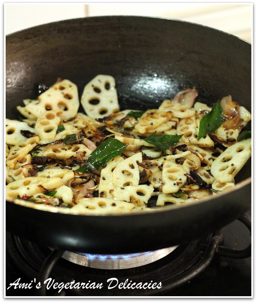 Stir frying lotus root in a large non-stick wok