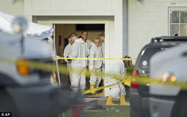Investigators work at the scene of a deadly shooting at the First Baptist Church in Sutherland Springs, Texas, Sunday 