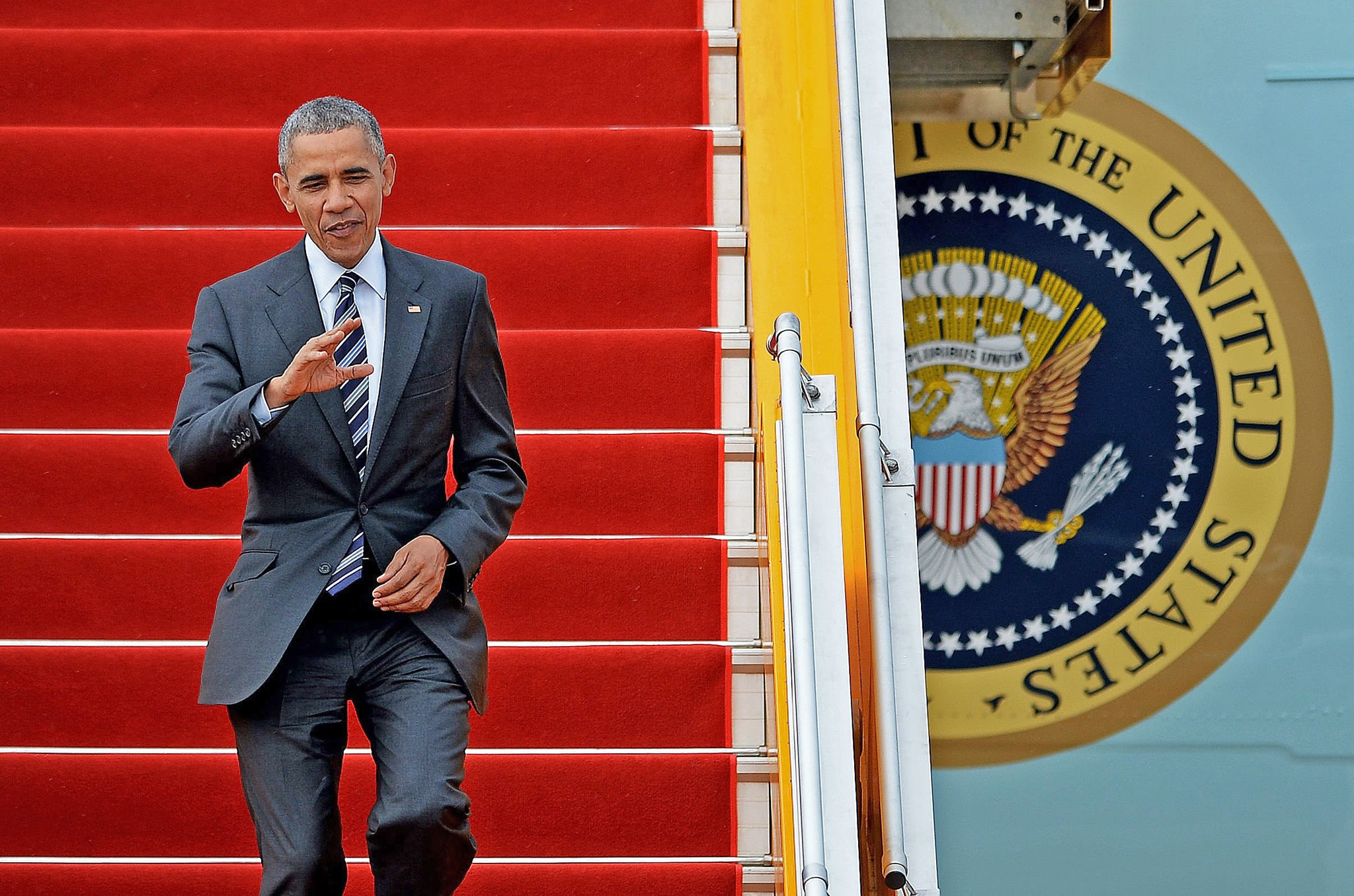 US President Barack Obama waves as he disembarks from Air Force One at the Tan Son Nhat airport in Ho Chi Minh City on May 24, 2016. Obama told communist Vietnam that basic human rights would not jeopardise its stability, in an impassioned appeal for the one-party state to abandon authoritarianism. / AFP PHOTO / CHRISTOPHE ARCHAMBAULTCHRISTOPHE ARCHAMBAULT/AFP/Getty Images