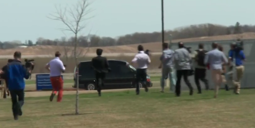 "Guy in the orange pants is pretty quick!" remarked MSNBC host Thomas Roberts, as media run after Hillary Clinton's "Scooby" van in Iowa.