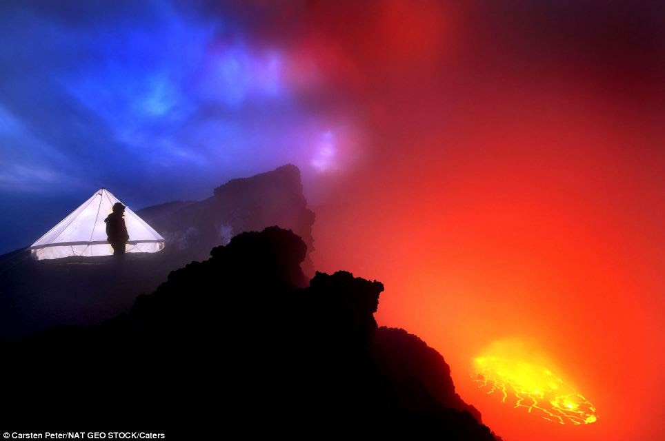 The daredevil group pitched their cooking tent on the rim of Nyiragongo overlooking the lava lake of one of the worlds most active volcanoes