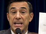 House Oversight Committee Chairman Rep. Darrell Issa, R-Calif. holds up a document as he speaks to IRS official Lois Lerner on Capitol Hill in Washington, Wednesday, May 22