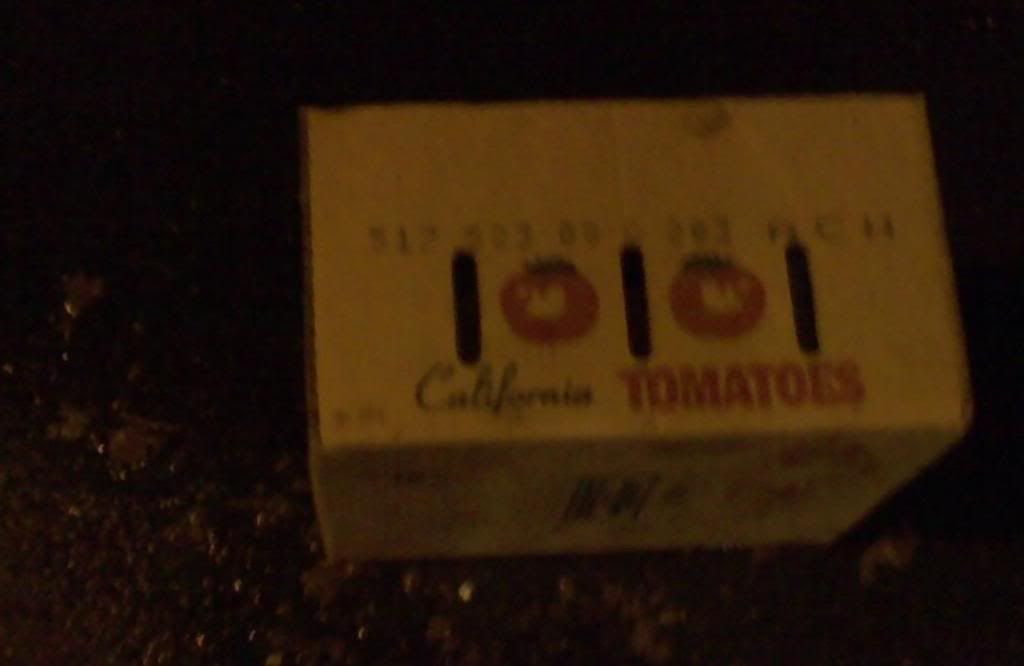a box of tomatoes, with interestingly placed air vents