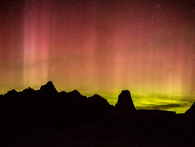 Lights from the aurora borealis dance over Badlands National Park on April 23 in South Dakota. A strong solar storm is expected to cause an expansion of the photogenic aurora borealis, or Northern Lights, across Canada and the northern U.S. on Sept. 12-13, 2014.