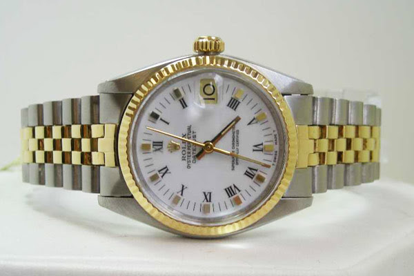 FS: ROLEX JUNIOR 31 mm. 14 KARAT GOLD AND STEEL $ 2,095.