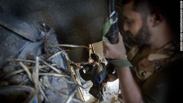Syrian rebels take position in a damaged house during clashes with regime forces in Aleppo on Wednesday, May 22. Tensions in Syria first flared in March 2011 during the onset of the Arab Spring, eventually escalating into a civil war that still rages. This gallery contains the most compelling images taken since the start of the conflict.