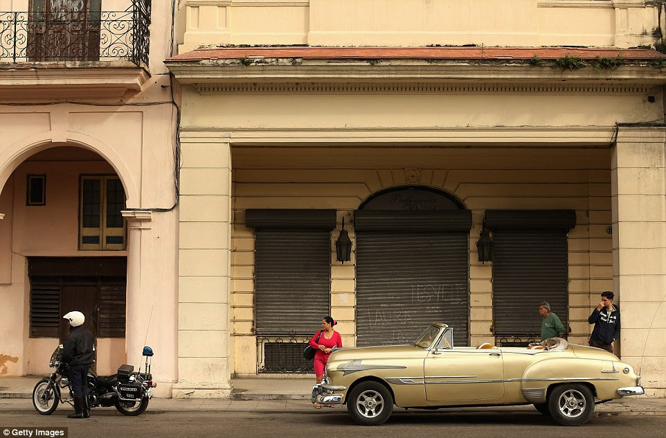 Also common in the country, cars that look as though they're from a bygone era, like this gold vintage American convertible car 