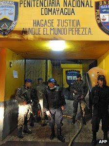 Army and police stand guard at the jail in Comayagua