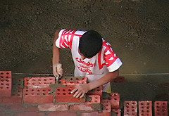 boy working 8 Vital skills to teach your children that will trump an Ivy League education