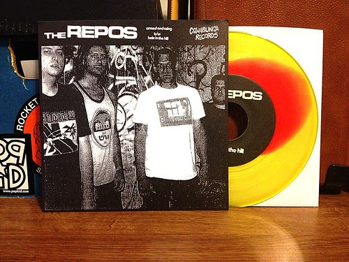 The Repos - Armed And Using 7" - Yellow & Red Vinyl (/100) by Tim PopKid