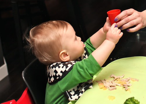 reaching for a cup of water