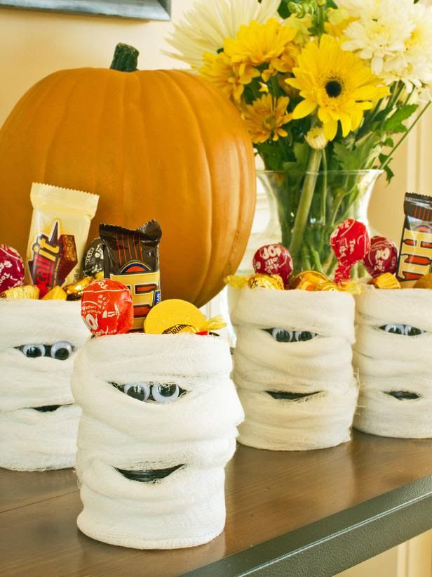 #Halloween Mummy Candy Cans (http://blog.hgtv.com/design/2013/10/16/daily-delight-halloween-mummy-candy-cans/?soc=pinterest)