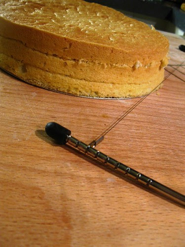 Slicing up the sponge cake in three layers