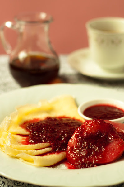 Crepes with stewed pears and raspberry sauce