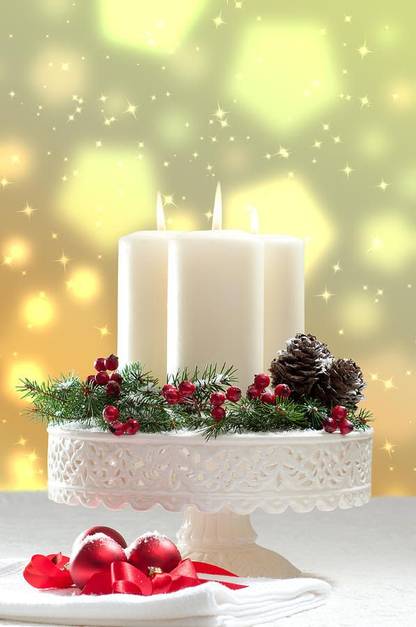 Christmas candles and greenery on a pretty cake plate