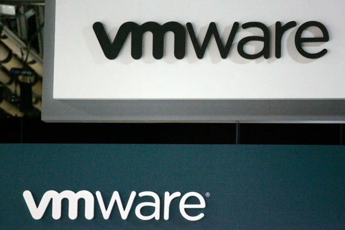 VMware Inc. signage is displayed at the EMC World conference in Las Vegas, Nevada, U.S., on Tuesday, May 10, 2011. EMC Corp., the world's biggest maker of storage computers, reported a 28 percent gain in first-quarter profit last month as companies increased spending on data centers capable of delivering tasks through the Internet. Photographer: Ronda Churchill/Bloomberg via Getty Images
