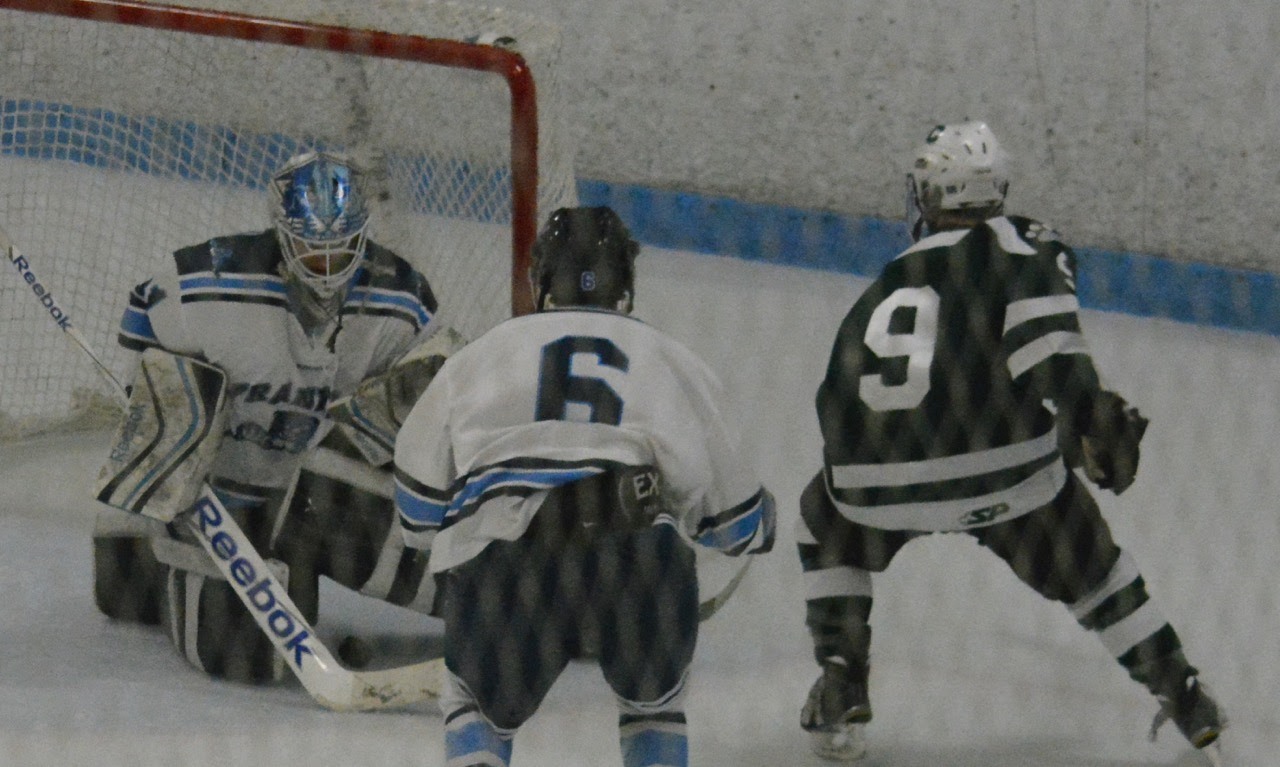 Franklin goalie Nick Jasinski (31) denies Canton forward Matt Lazaro (9) in the second period on Saturday. (Josh Perry/HockomockSports.com)