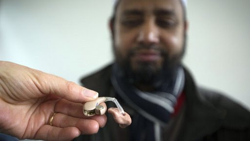 man and hearing aid