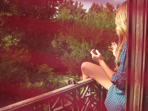And I think she's smoking. Shirt is gay. Way she is sitting is gay.