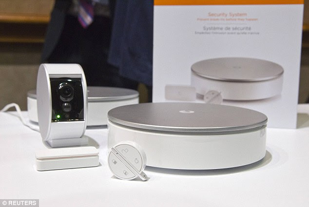 A MyFox wireless home security system is displayed here. The system includes a sensor that can tell the difference between natural noises and a break-in, and comes with a sliding physical cover for privacy
