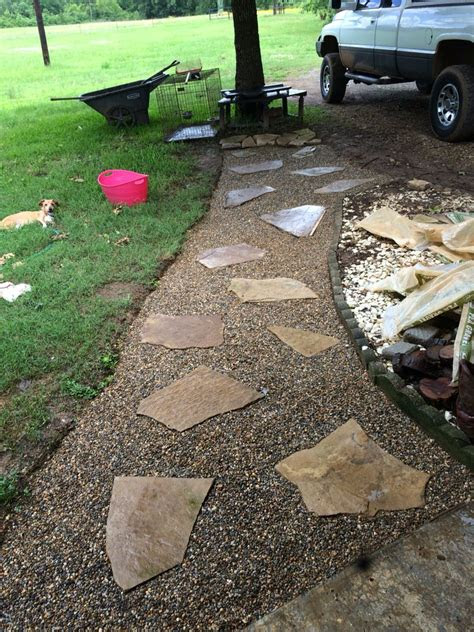 Wonder why her and not me? b. Diy walkway. Pea gravel from lowes and flagstone. Total